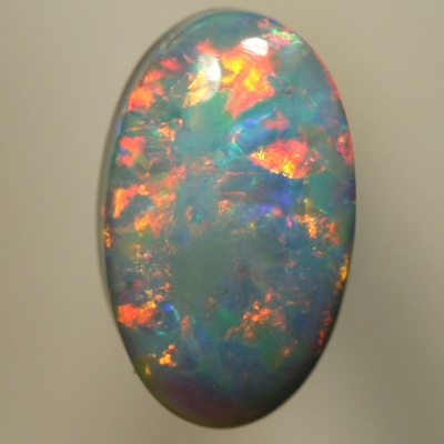 SOLID SEMI BLACK OPAL Rolling flashes of red and yellow over turquoise blue